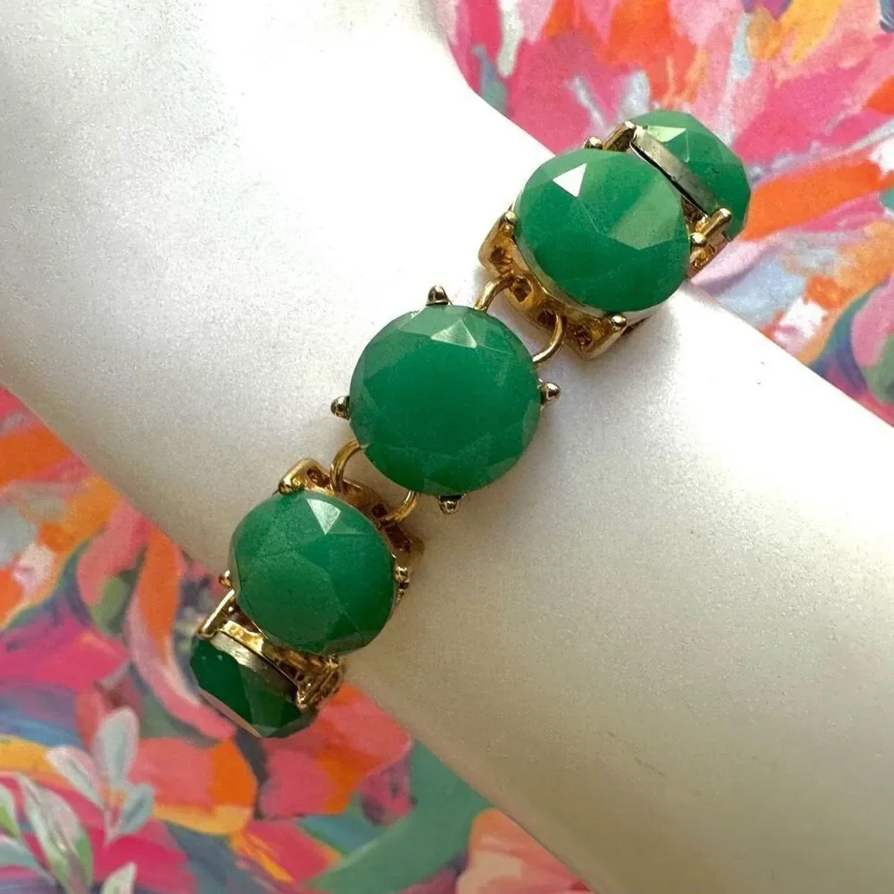 The Limited gold tone and green bracelet